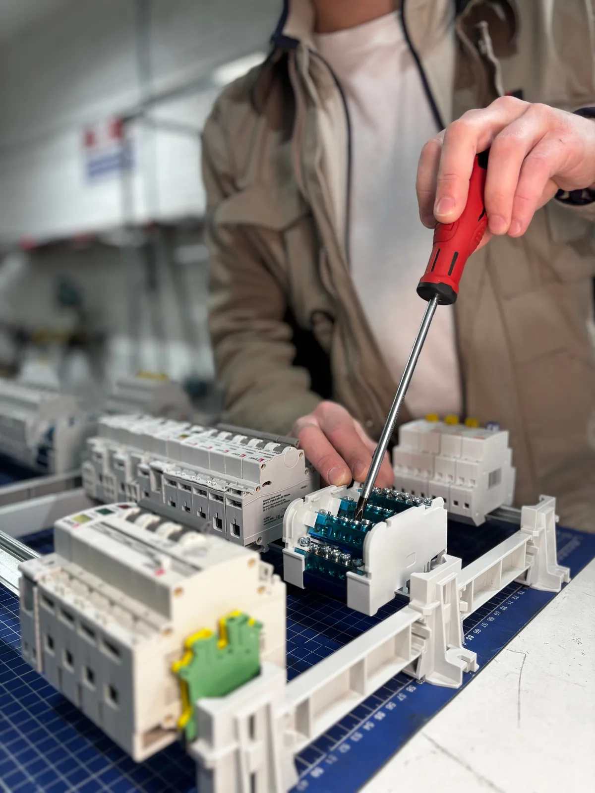 Breakers assembled on a DIN rail before installation, for licensed electrician in Vancouver