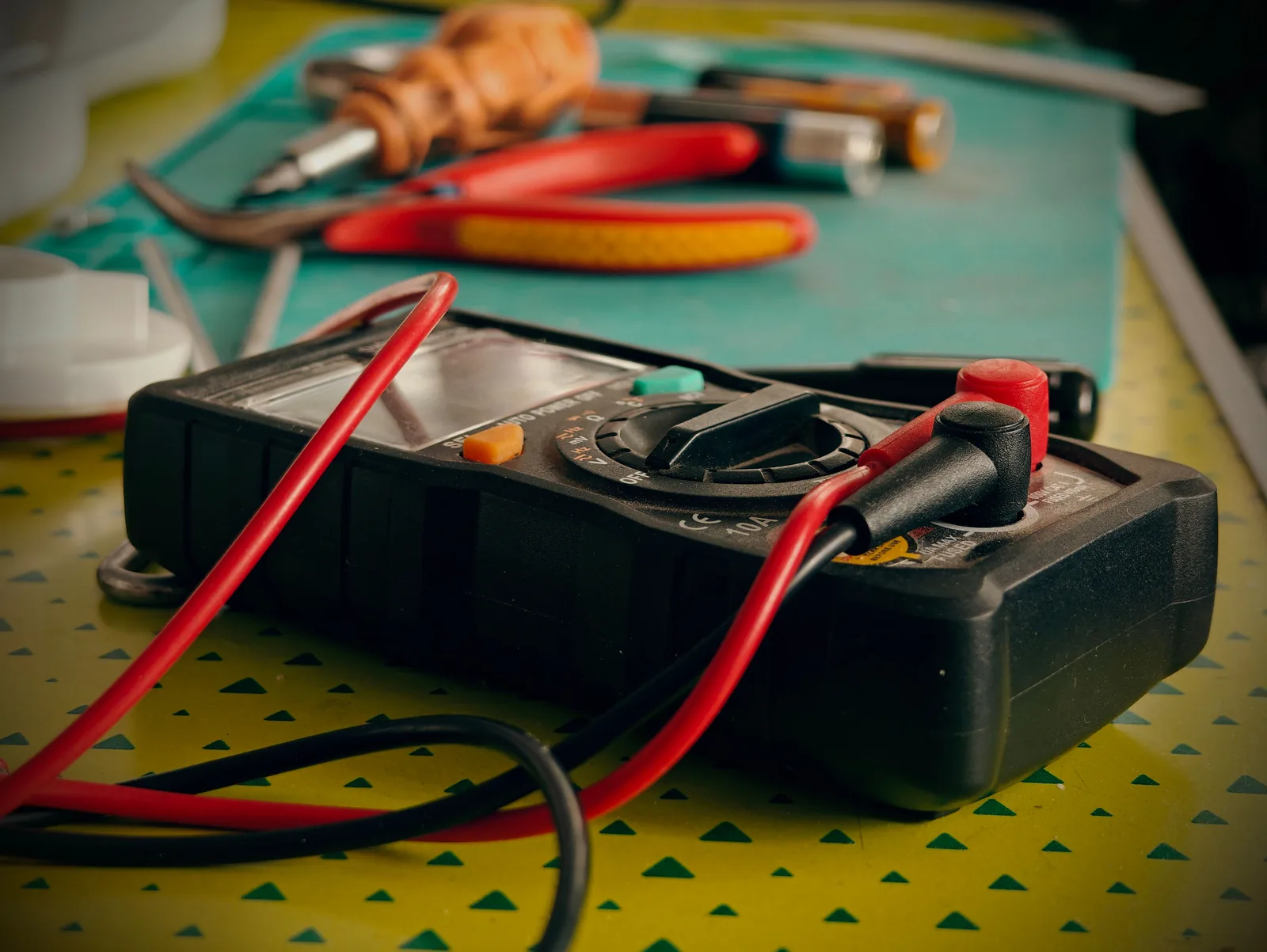A multimeter and hand tools ready for a diagnostic visit, for electrician in Vancouver