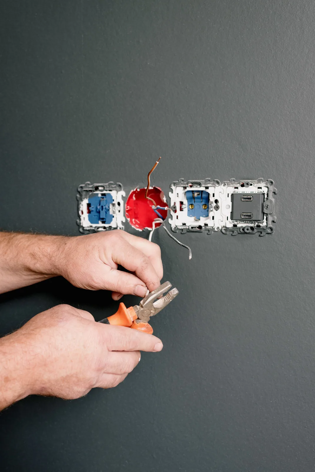 Wiring an outlet box into a finished wall, for code violation in Vancouver